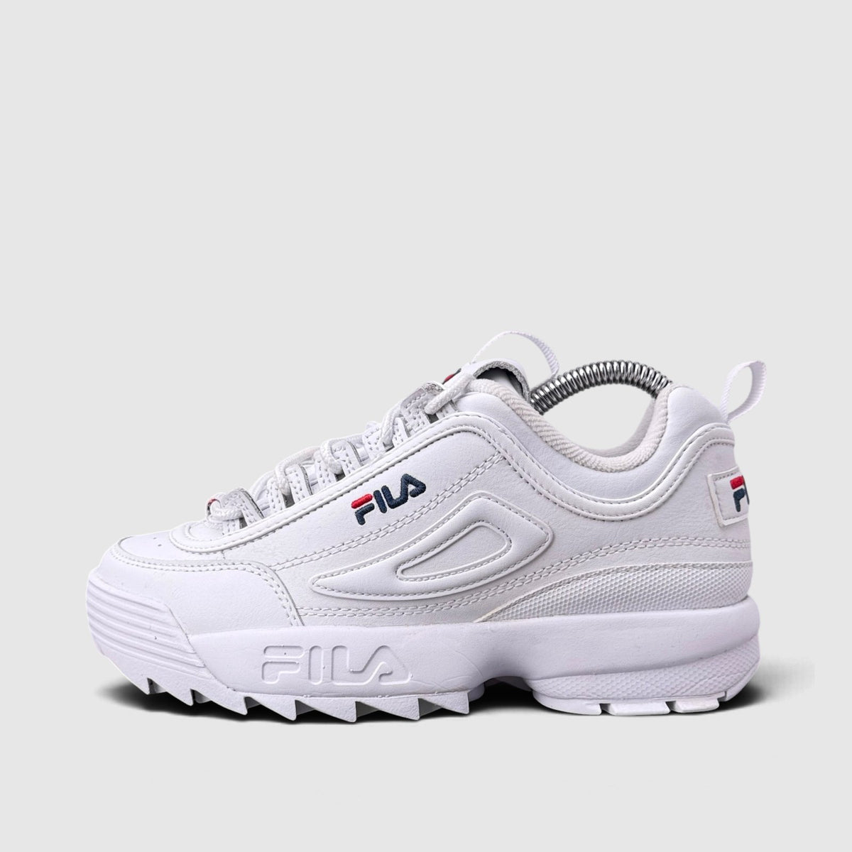 FILA Disruptor, buty sportowe damskie w bardzo dobrym stanie rozmiar 36.5, boczny profil, lewa strona